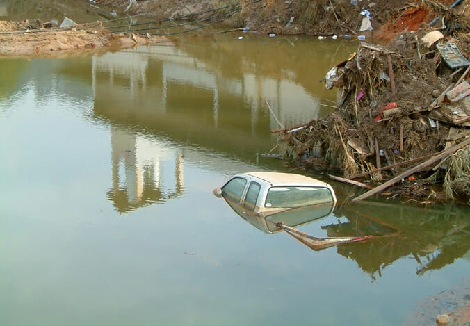 submerged pickup truck in water hole after tsunami, khao lak, thailand